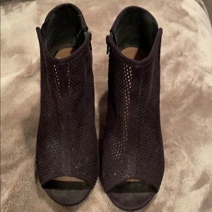 Peep toe suede booties with side zipper.